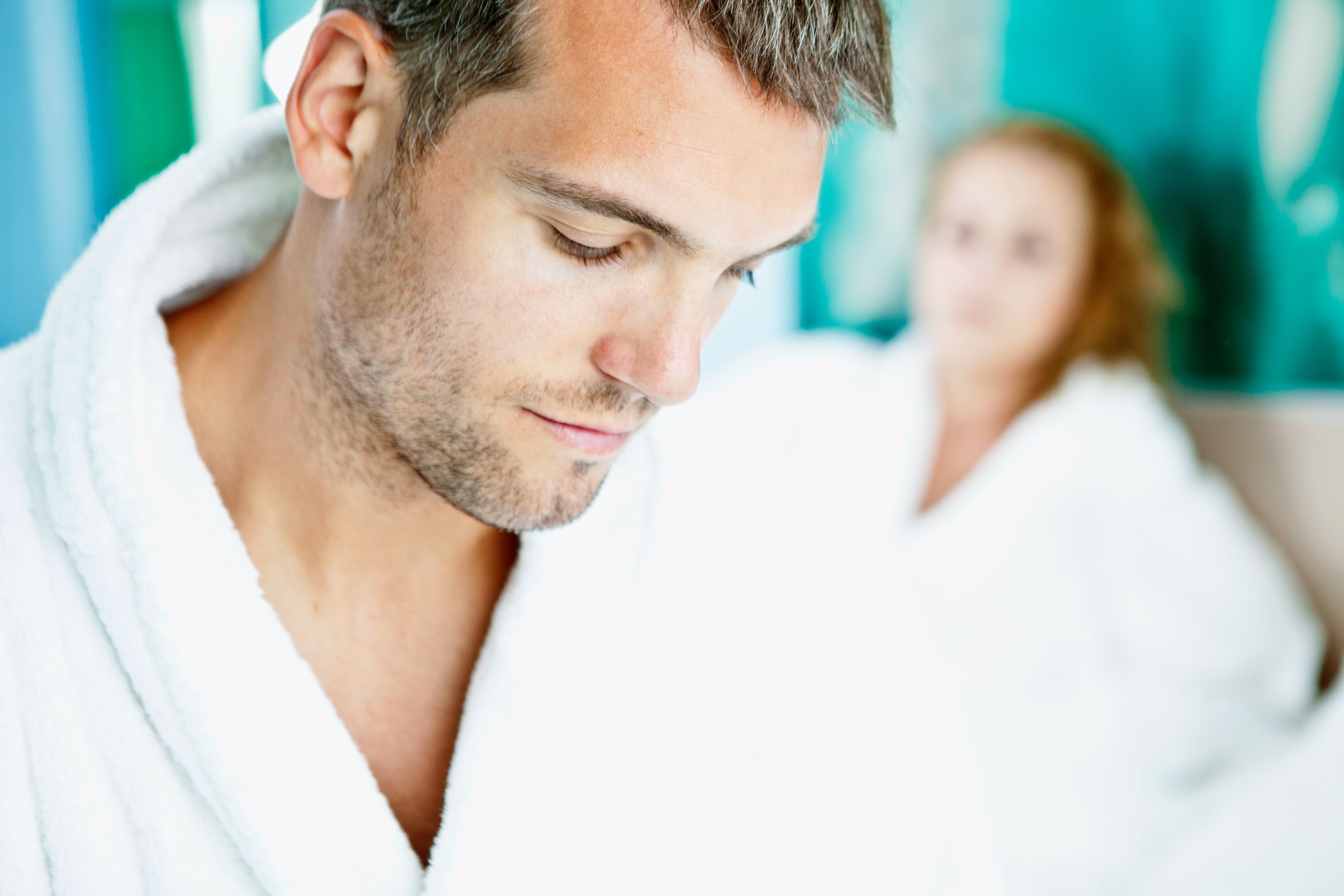 man and woman in bathrobe