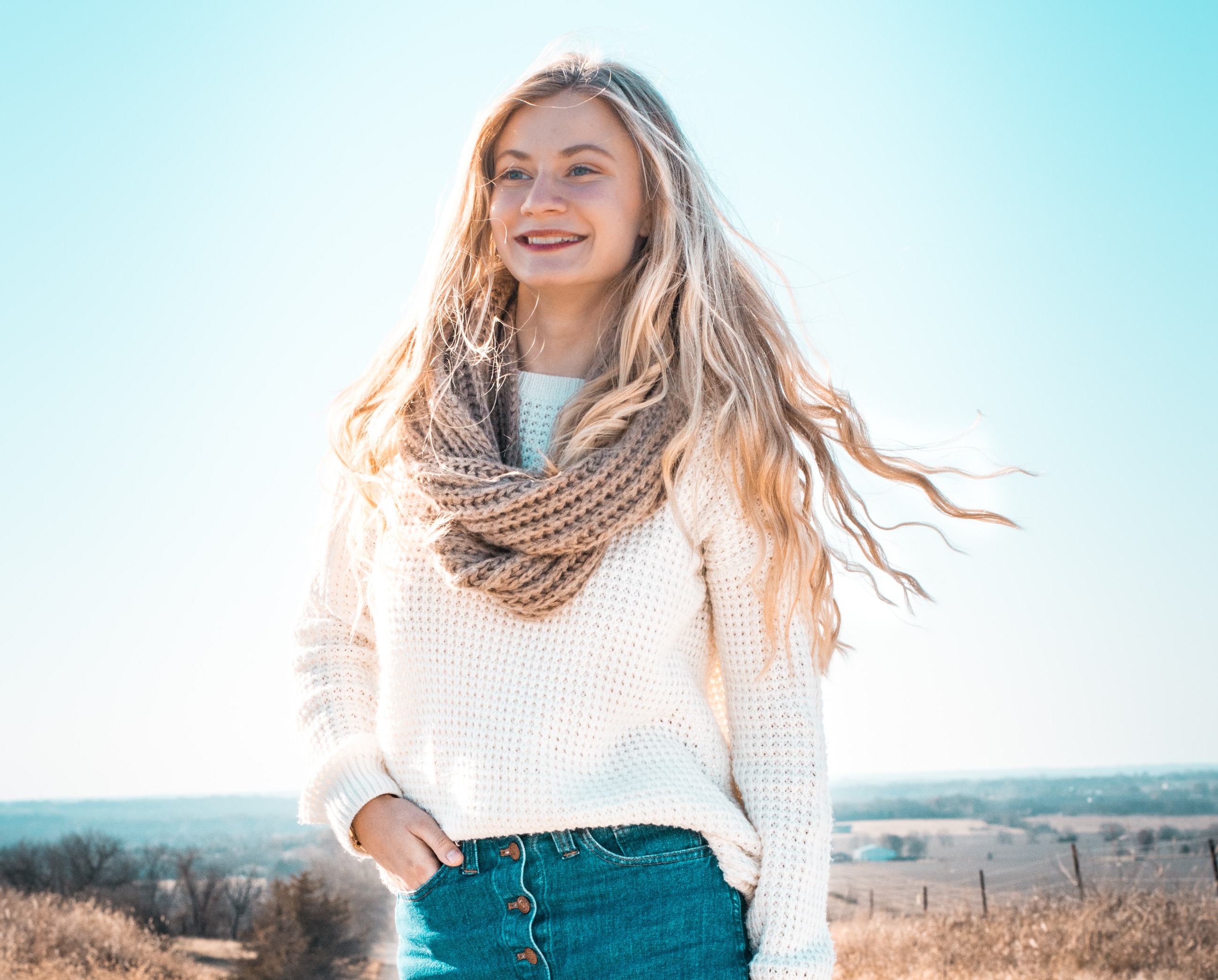 happy blonde woman on a road